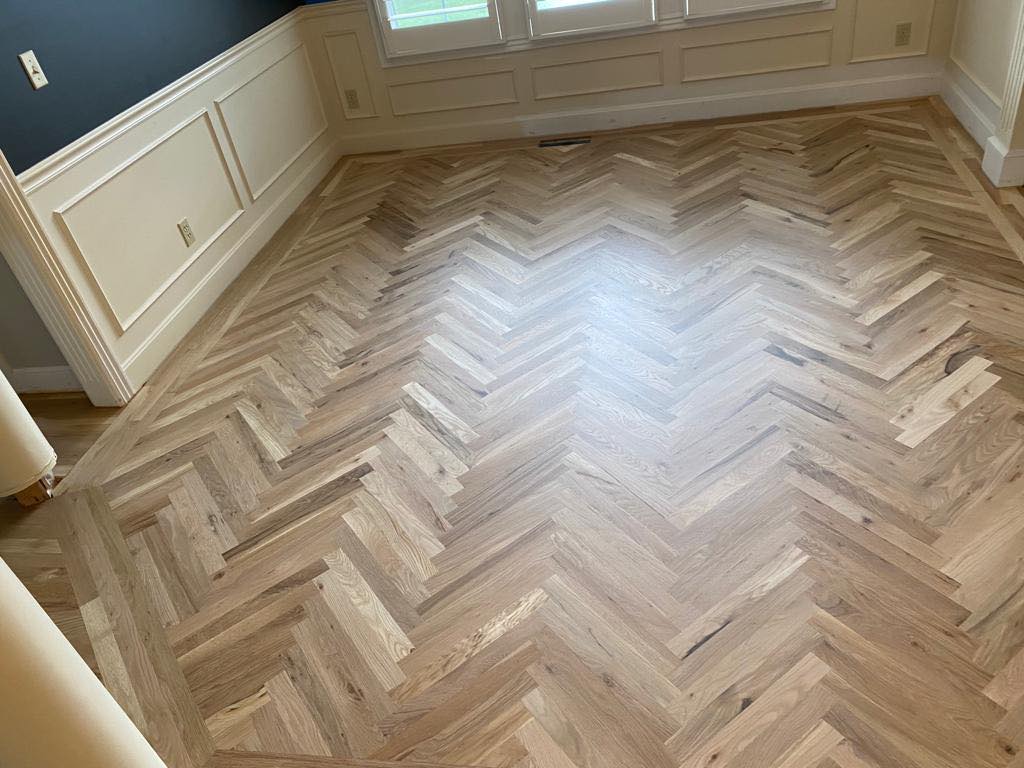 Dustless Hardwood Refinishing Transformation on HErribone Design Flooring in Olathe, KS