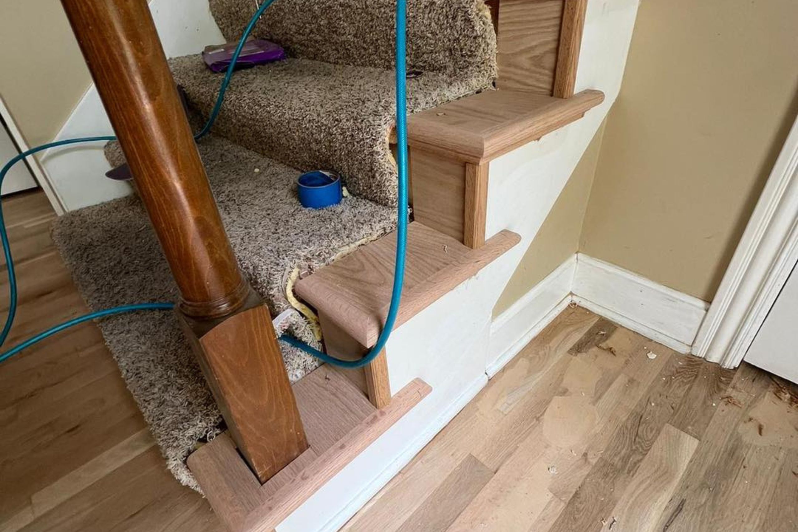 Hardwood stair installation in progress at a residential property in Kansas City, KS